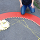 Illustration for article titled Guy Builds Giant Spirograph, Takes Chalk Art To the Next Level